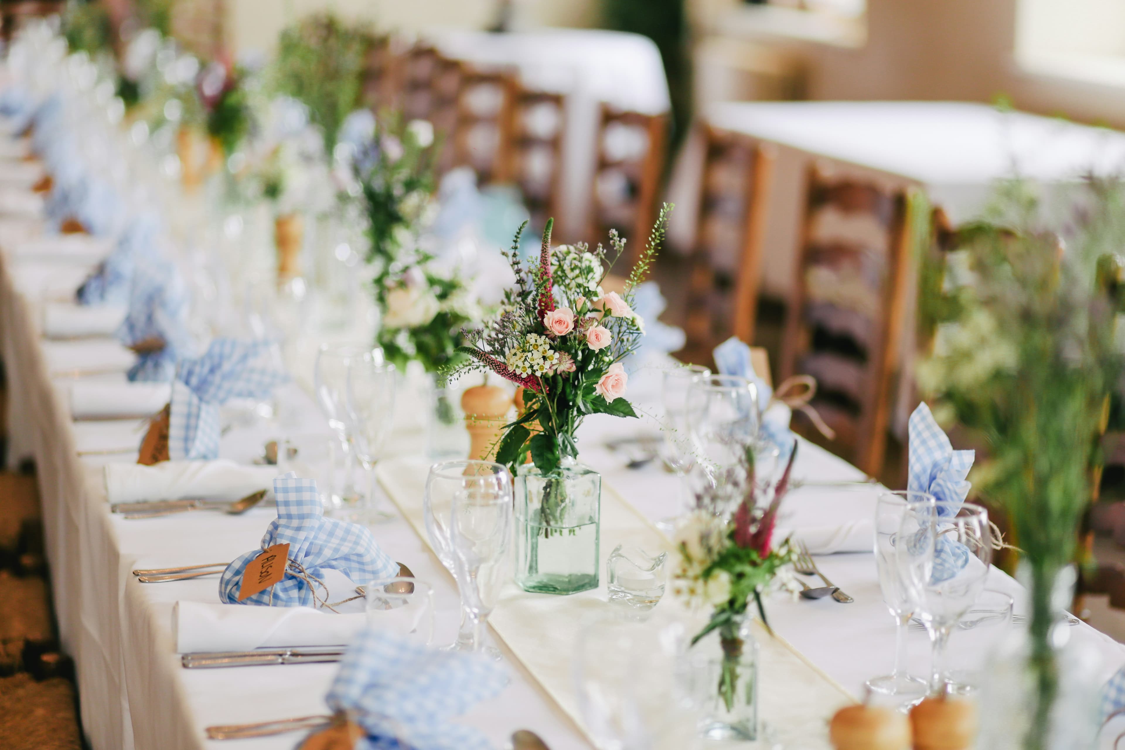 Wedding ceremony aisle with floral arrangement