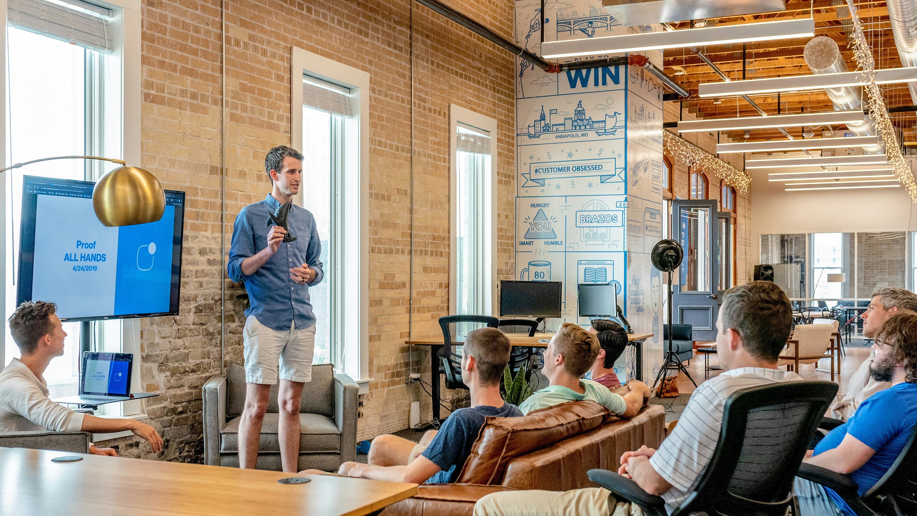 Executives working in a glass office